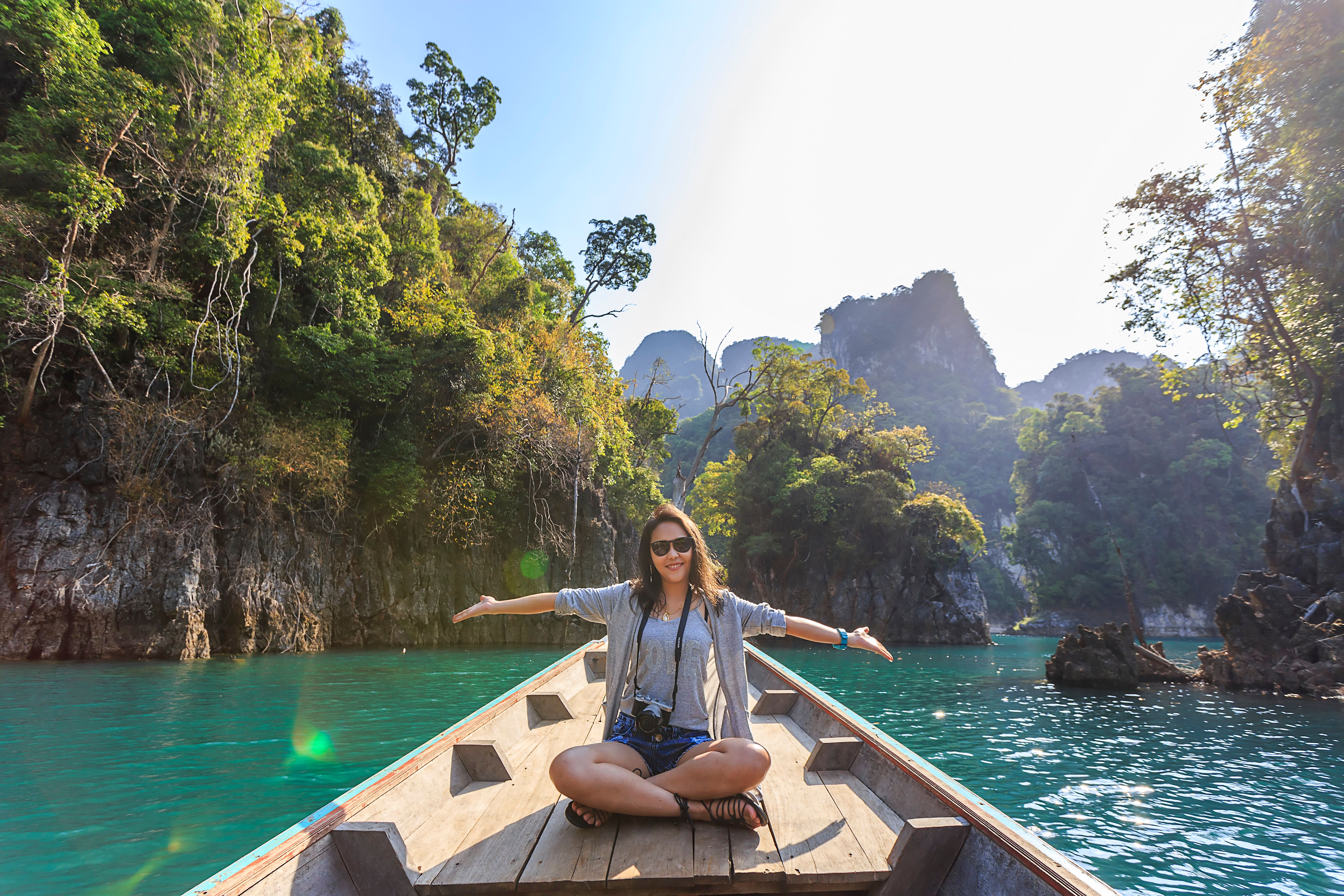 Scenic boat on calm water, holiday packages with beautiful travel destinations